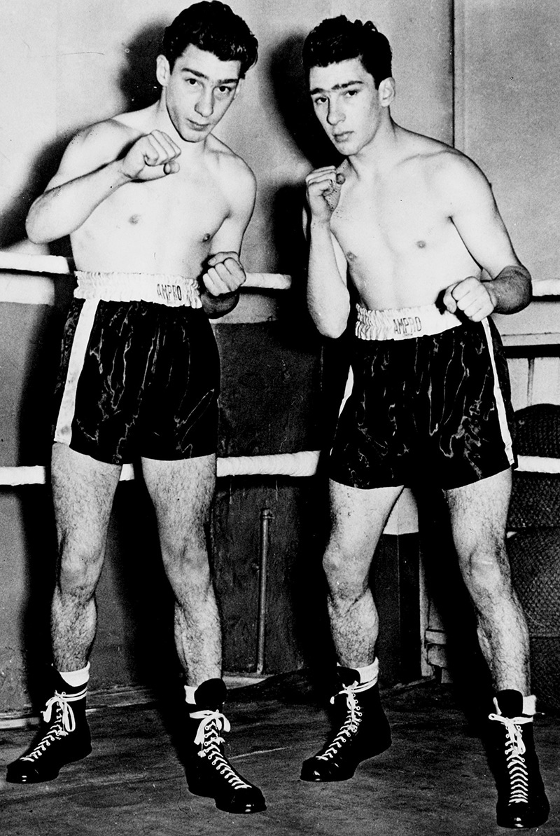 Gangsters Reggie Kray, left, and his twin brother Ronnie seen at a London gymnasium preparing for a boxing workout, 23rd January 1952  (Photo by Popperfoto/Getty Images)