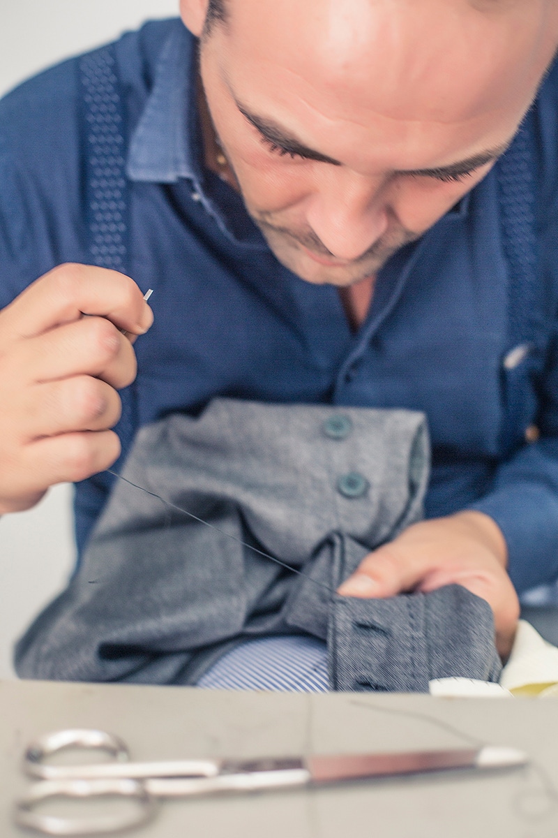 Antonio Ambrosi hand-stiches a pair of trousers