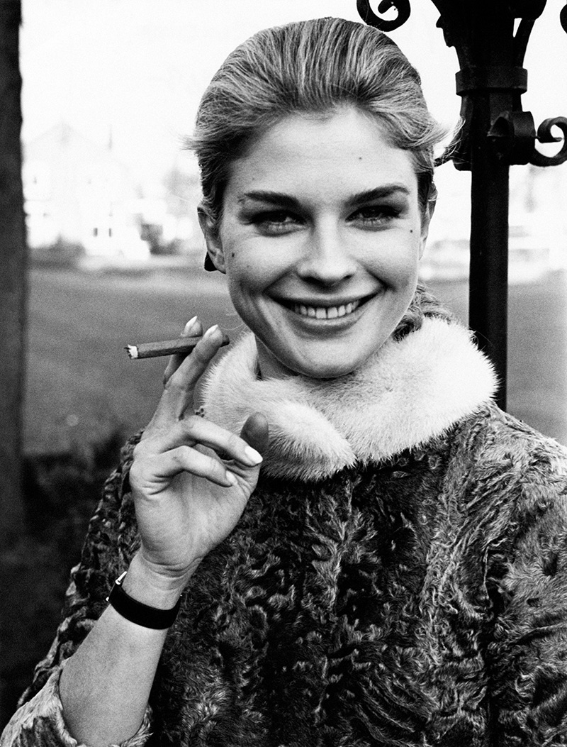 American actress Candice Bergen, smoking a cigarillo. 1967.
