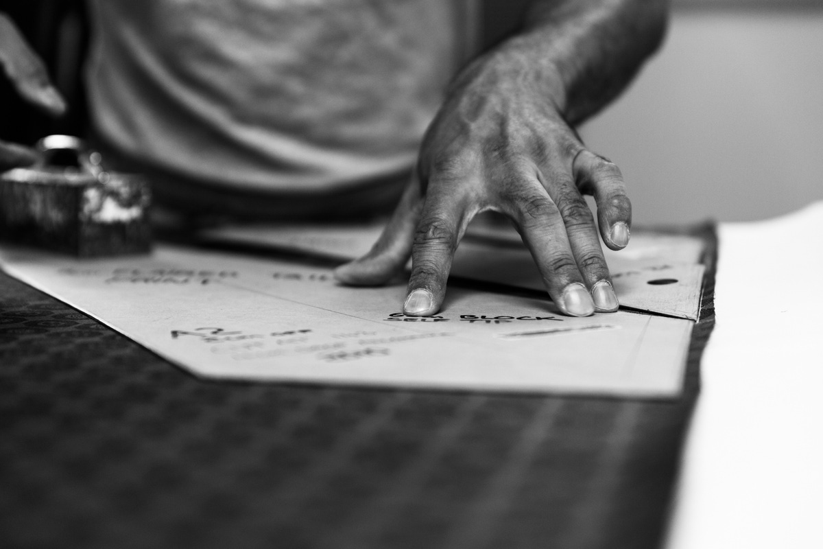 Marking out a silk foulard tie.