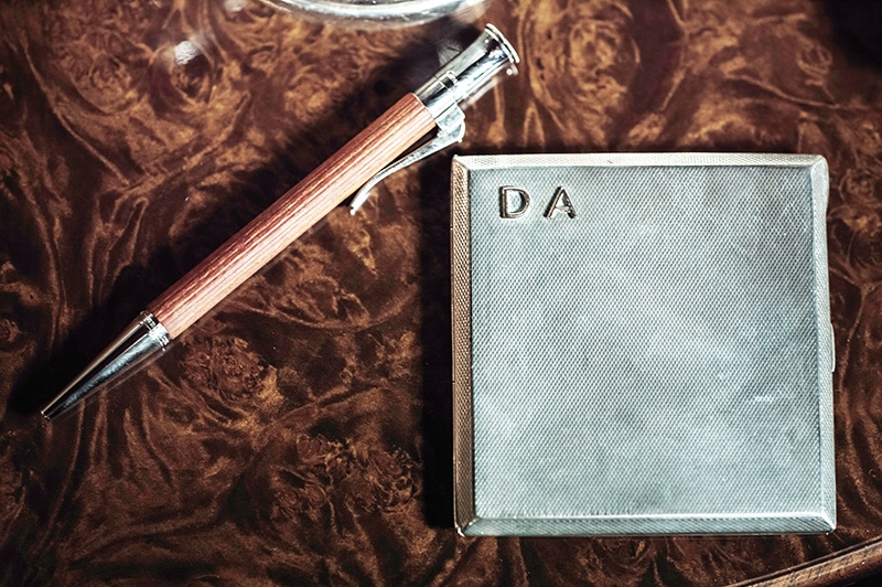 In the age of texting and instant messaging, keeping a pen as a constant companion is largely a lost tradition, but one Darius admirably continues. Here, the 1940s cigarette case was found in a bazaar and bears the initials of his childhood nickname.