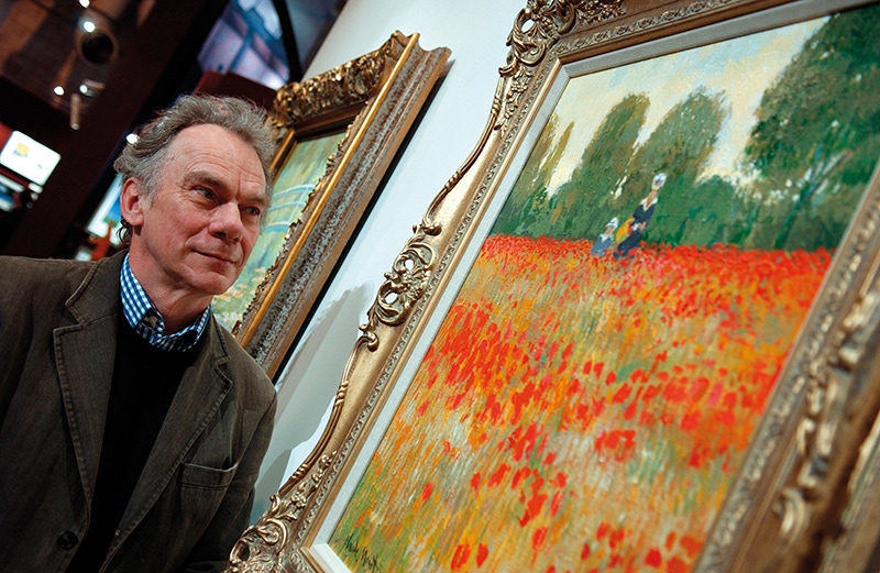 John Myatt with his interpretation of Camille Jean Monet's In a Poppy Field, 1873.