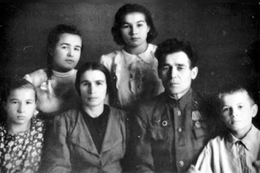 Portrait of Rudolf Nureyev, as a young boy, and his family.