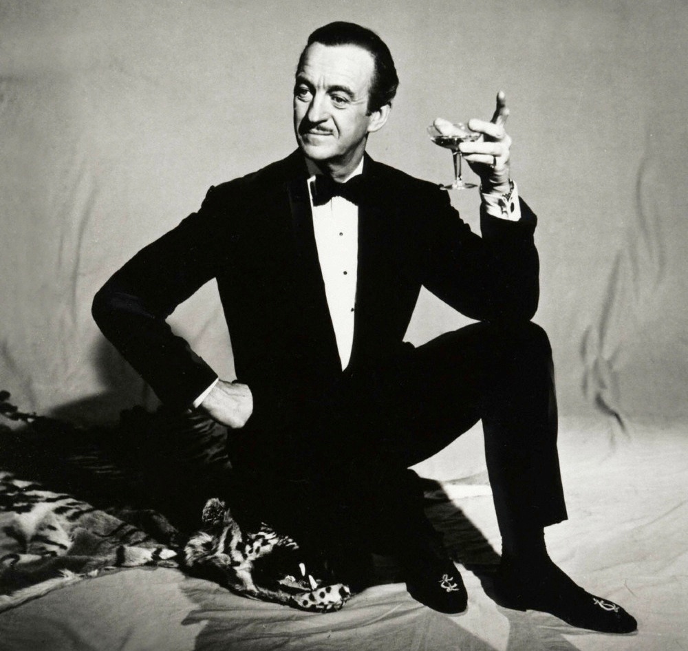 David Niven as Sir Charles Lytton, the urbane master jewel thief and titular 'Pink Panther'.