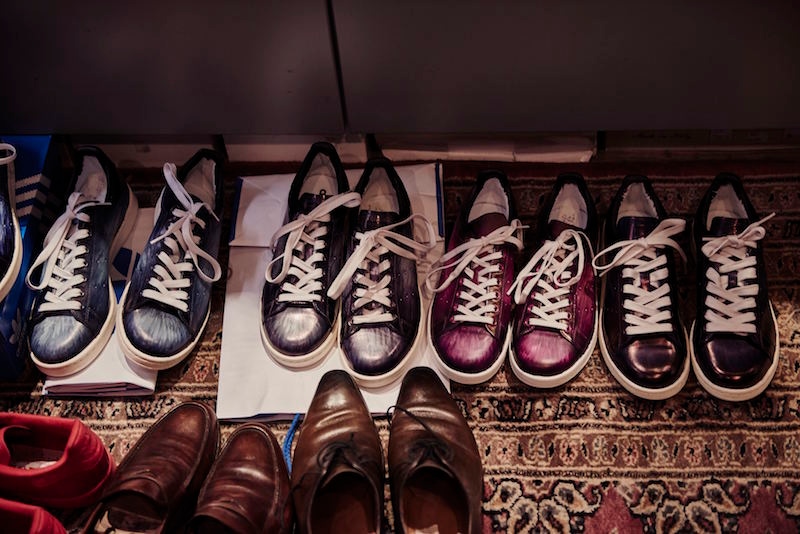 Freshly patinaed sneakers lined up to dry.