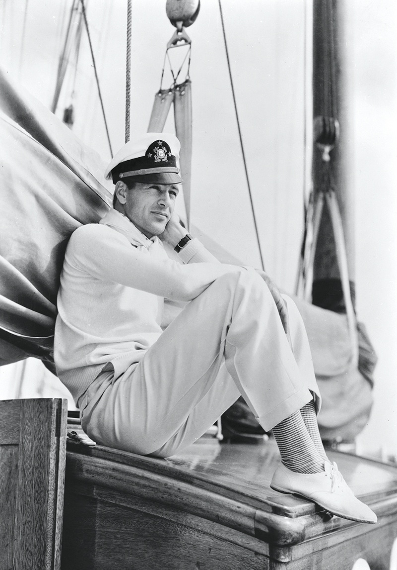 merican actor Gary Cooper sitting on board a yacht wearing a sailor's cap.  (Photo by John Kobal Foundation/Getty Images)