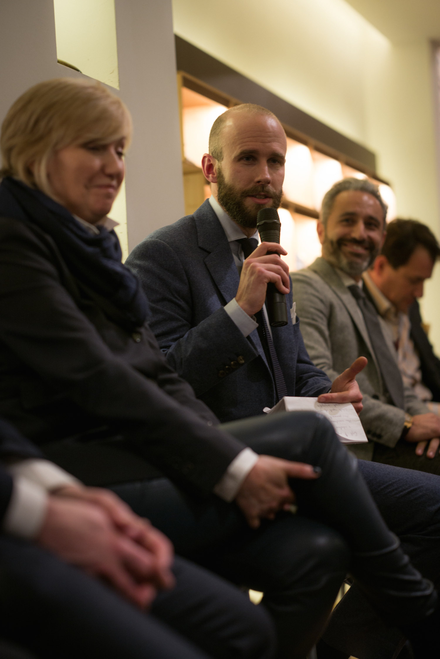 Simon Crompton and Tommaso Melani with the panel of speakers.