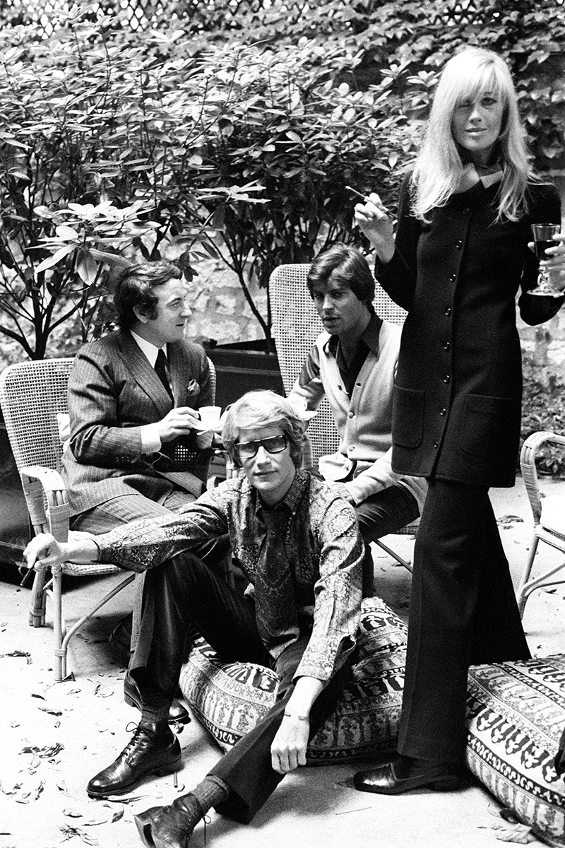 Yves Saint Laurent with partner Pierre Berge, Betty Catroux and her husband Francois Catroux in the graden of Yves Saint Laurent's Paris home. (Image by © Condé Nast Archive/Corbis)