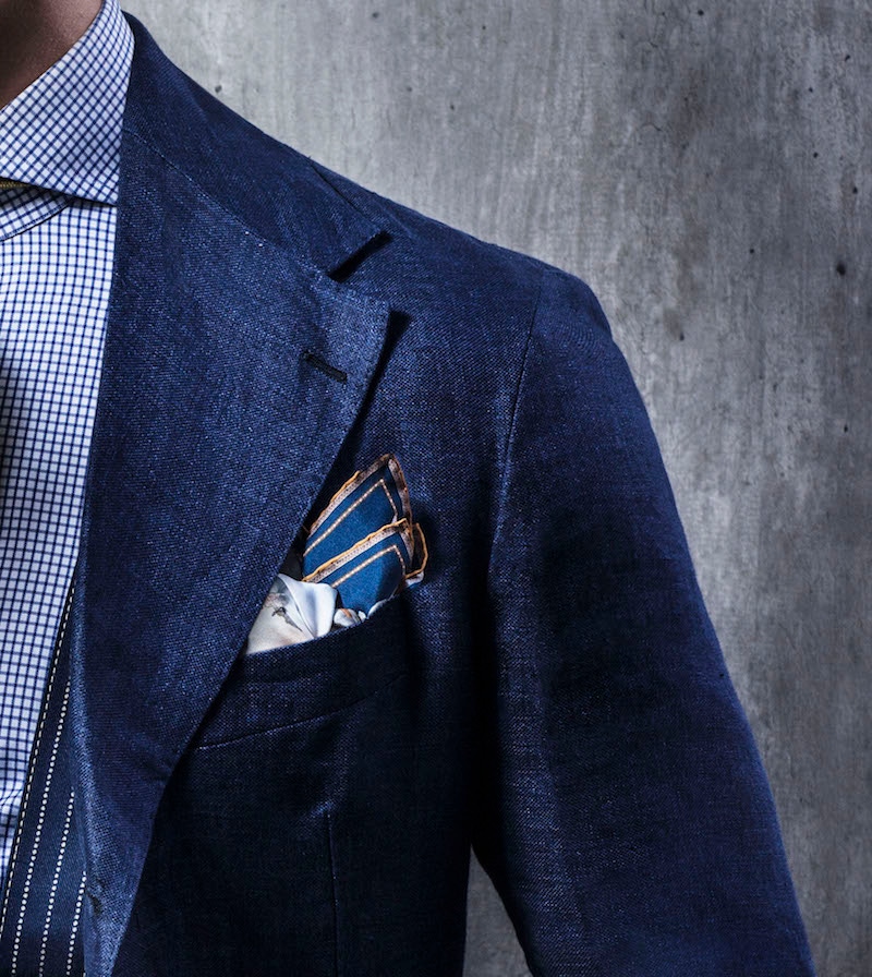 In rakish fashion, the blazer's lapels are heroically broad for a raffish summery aesthetic,