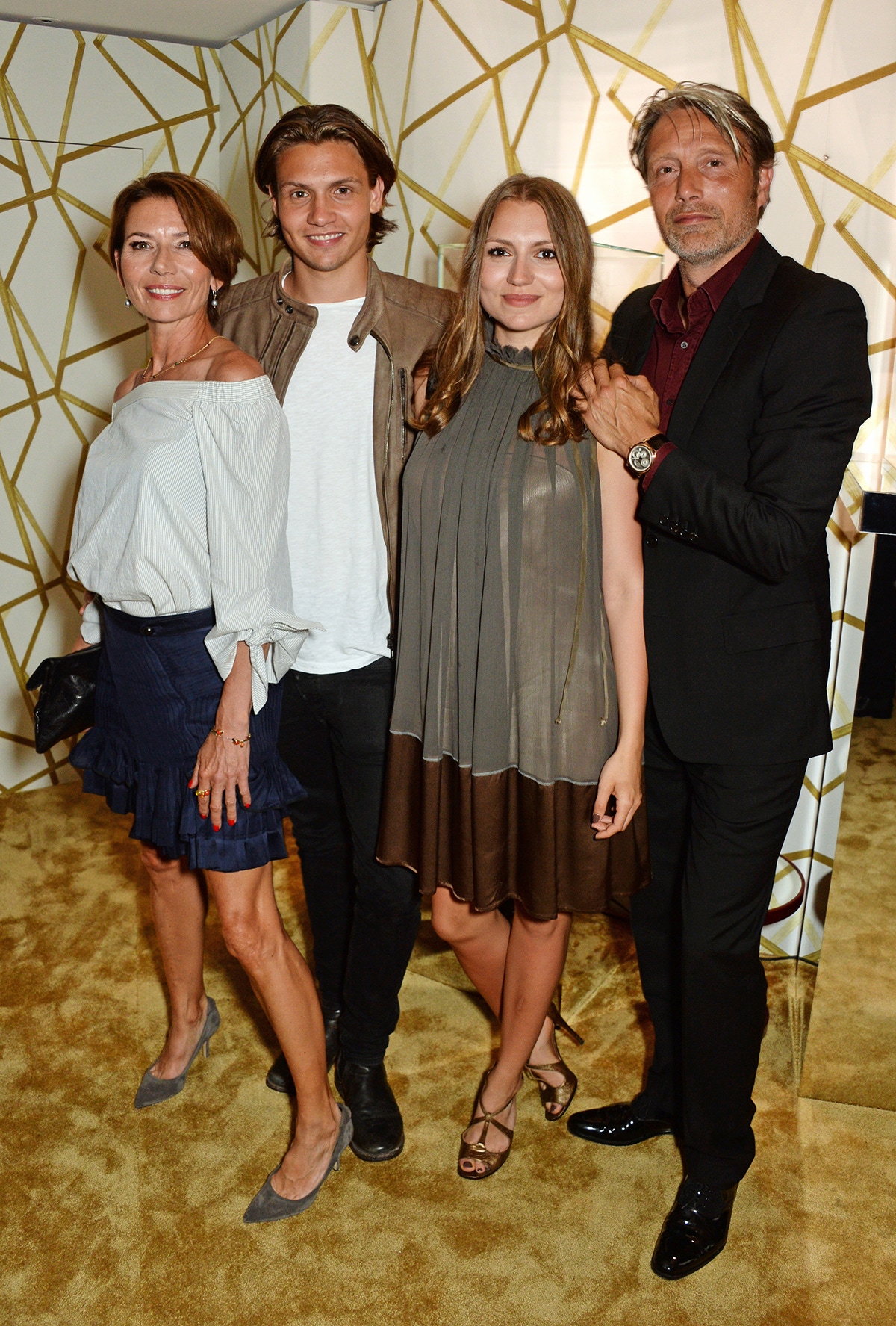 Mads Mikkelsen (R) poses with wife Hanne Jacobsen and children Carl Jacobsen Mikkelsen and Viola Jacobsen Mikkelsen attend the Chopard x Annabel's Cannes party on May 14, 2016 in Cannes, France.