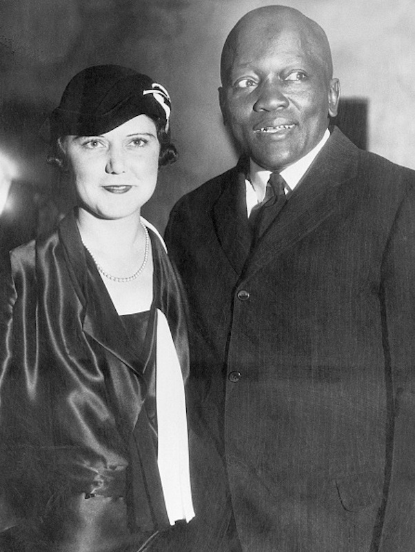 Jack Johnson standing with his fourth wife, Irene Pineau, at the opening of his nightclub, The Showboat, in Los Angeles 1931