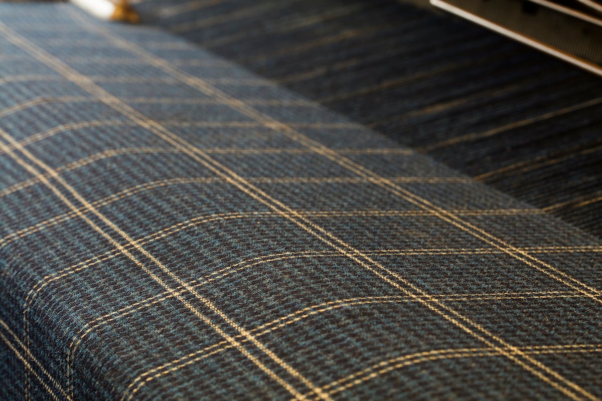 The Rake's unique Huntsman house tweed on the loom.