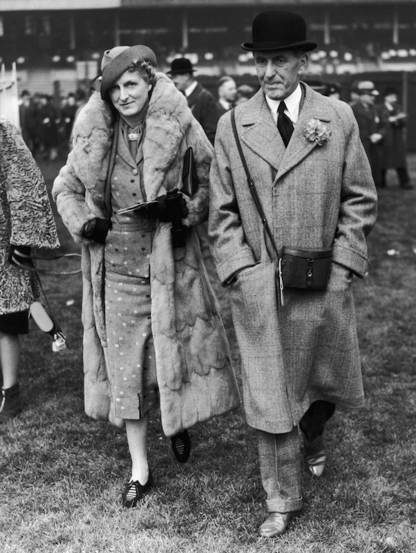 Sir John Henry 'Jock' Delves Broughton and Lady Delves Broughton attend the first day of the Chester races, 2nd May 1939.