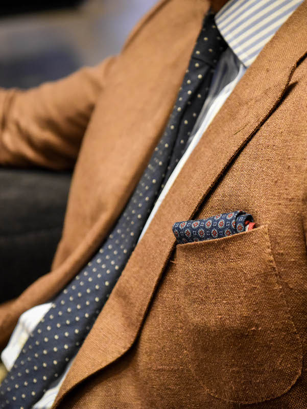 Joe’s necktie and pocket hanky are softly textured pieces from Gieves. “For me a tie and hanky have always got to be contradictory; there’s got to be some form of clash.”