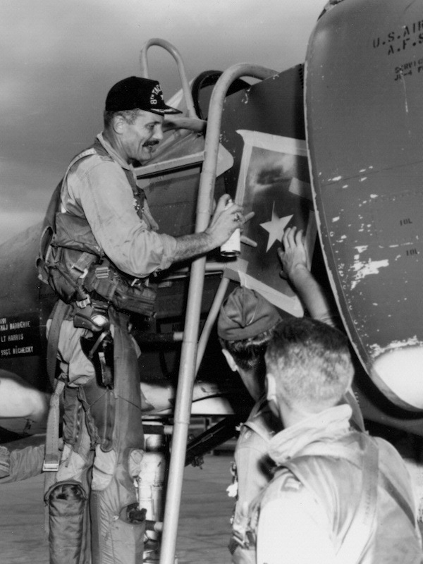 Robin Olds paints a star on an Air Force plane