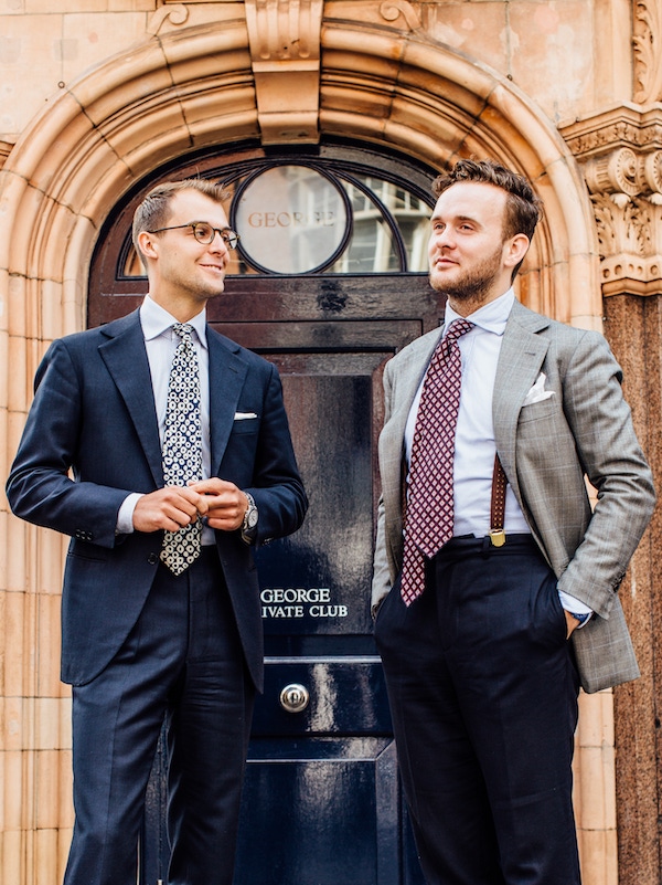 Both wear suits by Florentine master Antonio Liverano. “These are the first suits that Liverano made us” explains James, “when we started working with Liverano & Liverano, Mr Liverano just turned round to us and said, ‘if you’re going to work with me, you’re going to need to understand what I do. You need a blue suit and a grey suit, end of story. These are the cloths he chose for us, in the cuts he chose for us. That’s what’s special about Liverano; he knows exactly what you should wear, for what purpose, the colour, coordinating with the tone of your skin, your eyes, hair – everything. He creates clothes with a sense of harmony to them.”