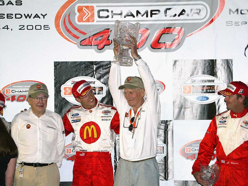 Owner Carl Haas, driver Sebastien Bourdais, owner/actor Paul Newman and Jimmy Vasser celebrate after winning the Champ Car World Series of Las Vegas at the Las Vegas Motor Speedway on September 24, 2005 in Las Vegas, Nevada (Photo by Frederick M. Brown/Getty Images)