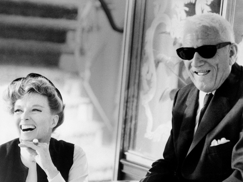 Katharine Hepburn and Spencer Tracy share a laugh during filming of the 1967 film, Guess Who's Coming to Dinner. Image © Underwood & Underwood/Corbis.