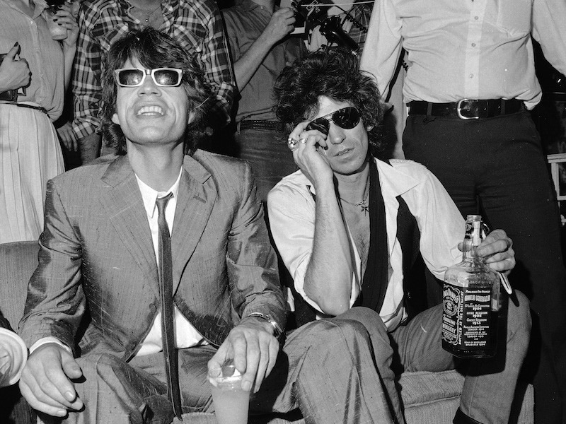 Mick Jagger, left, and Keith Richards of the Rolling Stones at a party in New York, 1980. Photograph by AP Photo/Suzanne Vlamis.