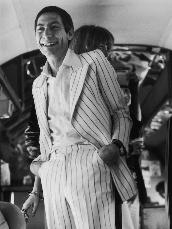 Drummer Charlie Watts in one of his many suits during the Rolling Stones' 1975 Tour of the Americas. Photo by Christopher Simon Sykes/Hulton Archive/Getty Images.