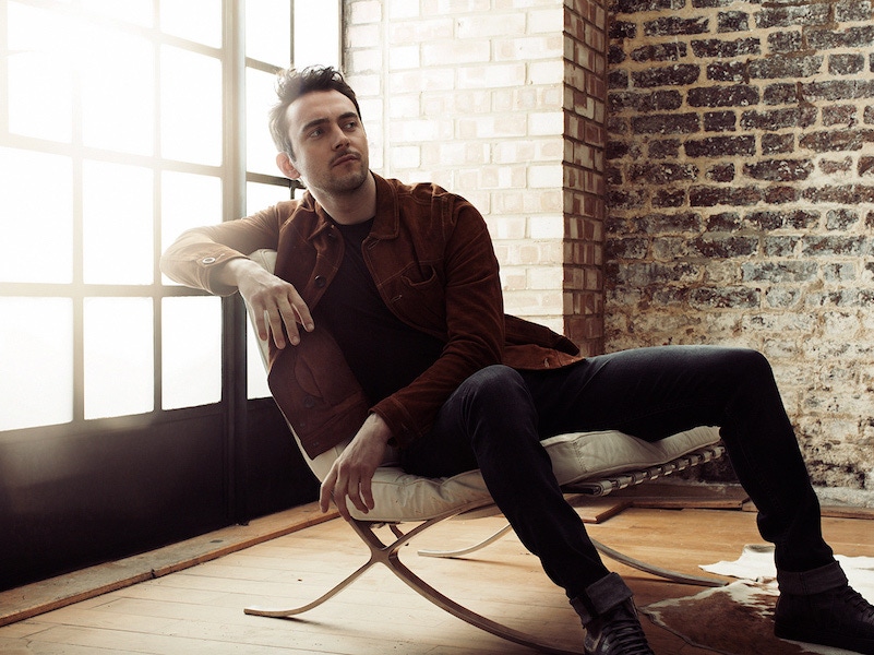 Brown suede shirt, Oliver Spencer; grey cashmere crew-neck jumper and black velvet belt, both Giorgio Armani; indigo blue denim jeans, 7 for all Mankind; blue crocodile-leather high top sneakers, Santoni.