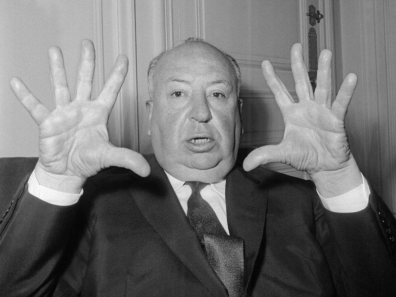 British film director Alfred Hitchcock gestures as he gives a press conference in Paris to present his last movie 