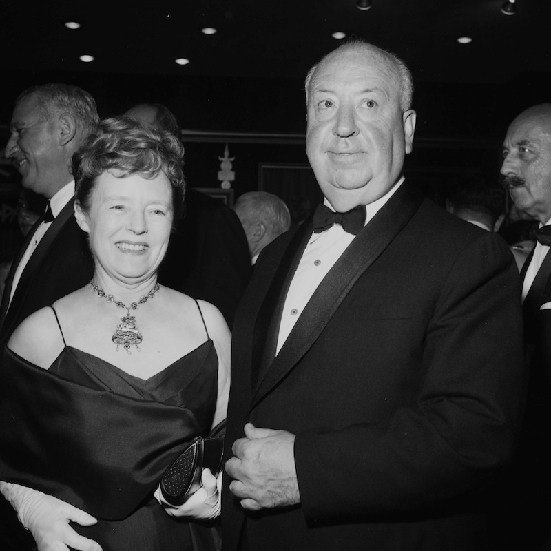 Alfred Hitchcock with wife Alma Reville attends a premier in Los Angeles, California. Photo by Earl Leaf/Michael Ochs Archives/Getty Images.