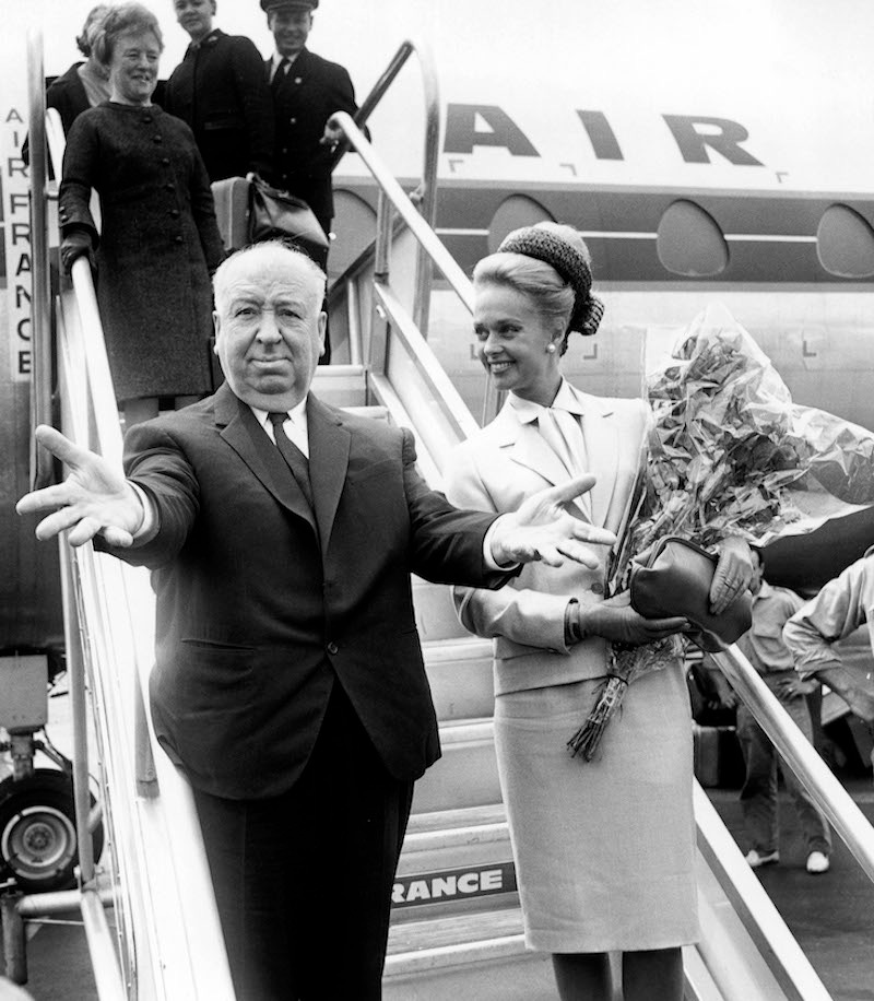 Alfred Hitchcock arriving at Nice airport with American actress Tippi Hedren on their way to to promote 'The Birds' at the Cannes Film Festival, 10th May 1963. Photo by RDA/Getty Images.