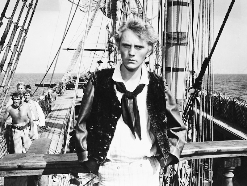 Terence Stamp, British actor, in period costume on the deck of a ship, in a publicity portrait issued for the film, 'Billy Budd'. Photo by Silver Screen Collection/Getty Images.