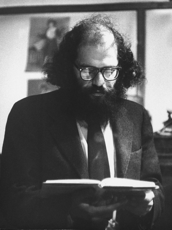 Poet Allen Ginsberg reading from book to unseen audience. Photo by Burt Shavitz/Pix Inc./The LIFE Images Collection/Getty Images.