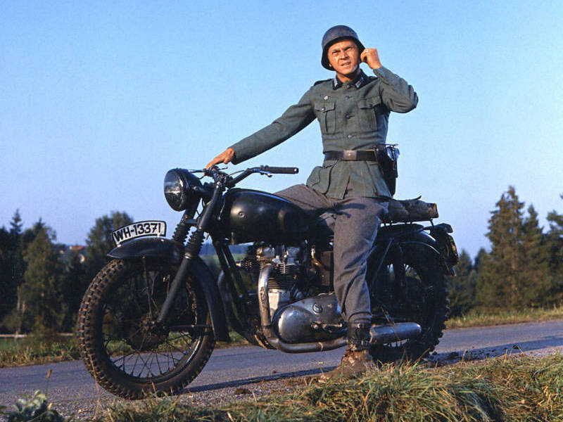 Steve McQueen wearing a German military uniform, sitting astride a motorcycle in a publicity still issued for the film, 'The Great Escape', 1963. starred McQueen as 'Captain Virgil 'The Cooler King' Hilts'. Photo by Silver Screen Collection/Getty Images.