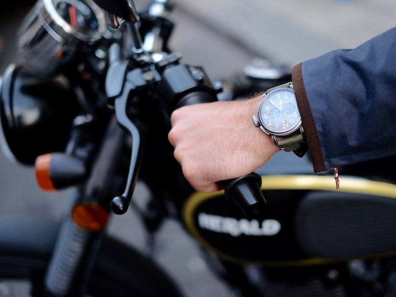 A Zenith Pilot Ton Up watch worn astride a Herald Classic 125. Photograph by Justin Hast.