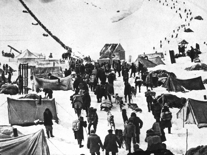 Circa 1895:  A caravan of prospectors arriving at the snowy wastes of the Klondike in Canada to join the great Gold Rush.  (Photo by Topical Press Agency/Getty Images)