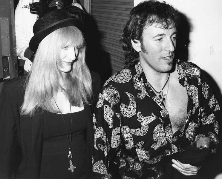 Musician Bruce Springsteen and his date attending an event, circa 1985. Photo by Kevin Winter/Getty Images.