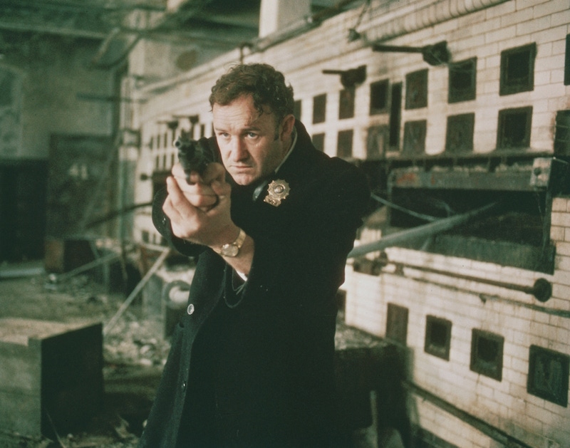 Gene Hackman as Detective Jimmy 'Popeye' Doyle points his handgun in a still from the film 'The French Connection', 1971. Photo by 20th Century Fox/Getty Images.