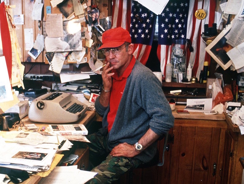 Gonzo journalist Hunter S. Thompson sits in his home September 1990 at Woody Creek, near Aspen, CO. Photo by Paul Harris/Liaison.