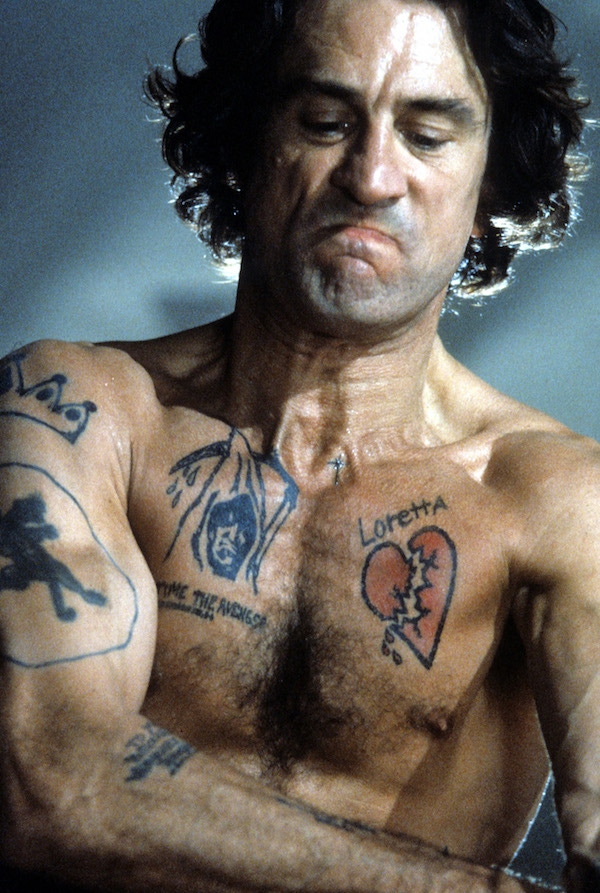 Robert De Niro shows off his tattoos in a scene from the film  'Cape Fear', 1991. Photo by Universal/Getty Images.