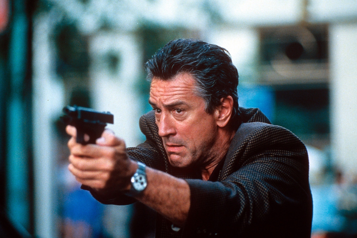 Robert De Niro aiming gun in a scene from the film '15 Minutes', 2001. Photo by New Line Cinema/Getty Images.