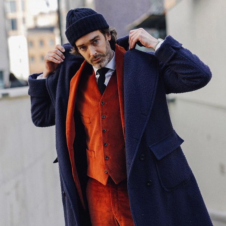 Richard Biedul contrasts his exclusive navy Rubinacci x The Rake Casentino coat with a vibrant corduroy suit.