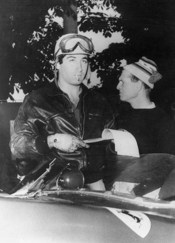 Racing driver Marquis de Portago and on the right Peter Collins before the start of the Mille Miglia Road Race when the tyre on the Marquis's Ferrari burst causing a crash which killed him, his co-driver and twelve spectators, 1957. Photo by Keystone/Getty Images.