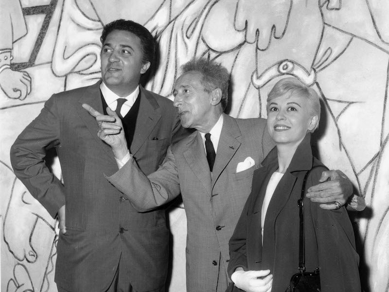 Federico Fellini and Giulietta Masina visiting the Saint Peter chapel decorated by Jean Cocteau, 1957 in Villefranche sur mer, France during Cannes film festival.