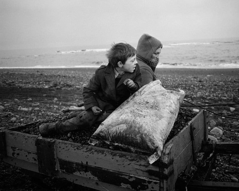 Rocker and Rosie Going Home, Seacoal Beach, Lynemouth, 1984, by Chris Killip.
