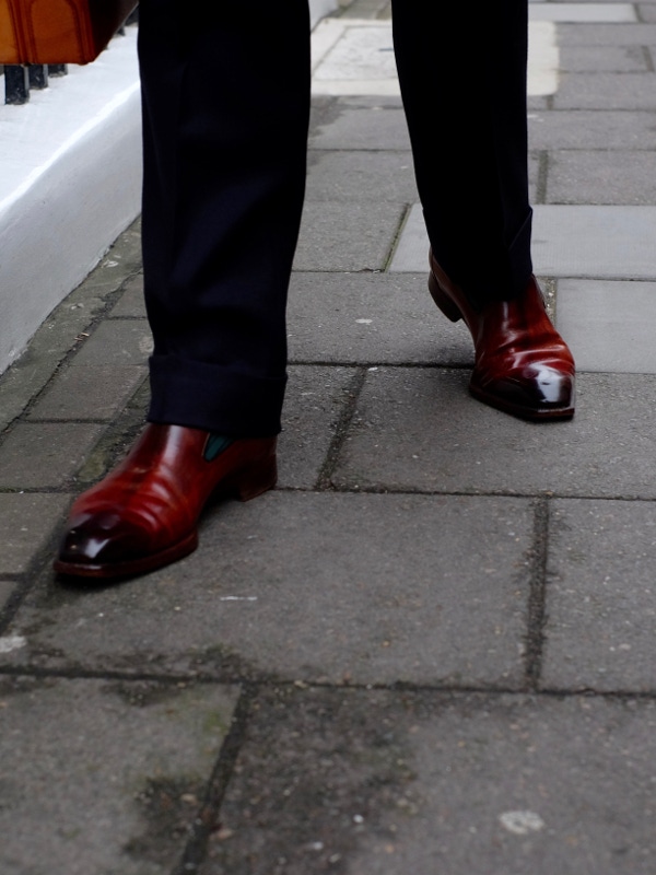 Clive’s shoes are from the great Riccardo Bestetti, and show-off his signature angular silhouette beautifully. Impressively, the patina is Clive’s own handiwork. Note the wooden pegs which attach the sole to the uppers – an idiosyncratic method that Bestetti has used for years. “If I need to replace the soles I’ve no idea how I could get it done” says Clive, “so I try to wear them as little as possible.”