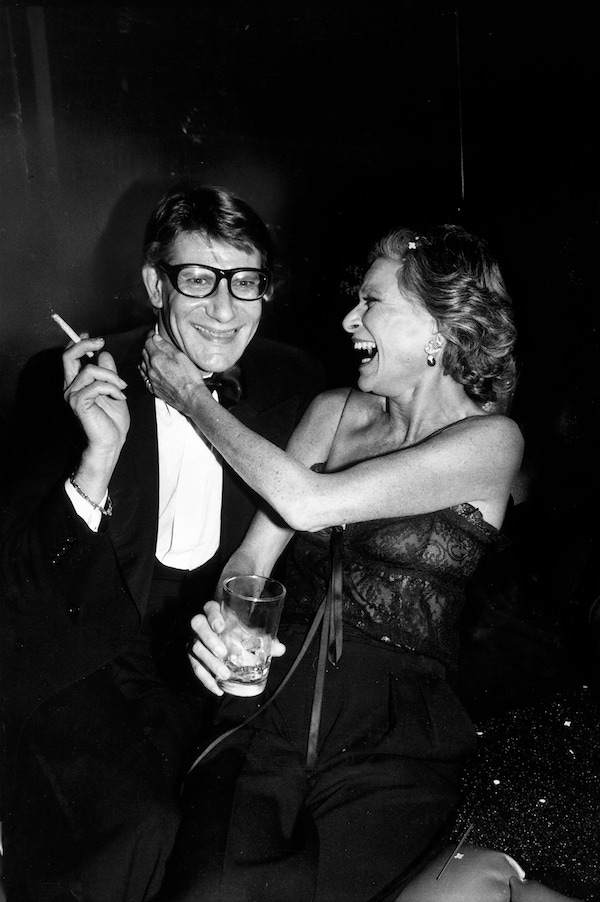 Designer Yves Saint Laurent with socialite Nan Kempner during party for the launching his new perfume called Opium, held aboard the sailboat Peking at the South Street Seaport Museum. Photo by Robin Platzer/The LIFE Images Collection/Getty Images.