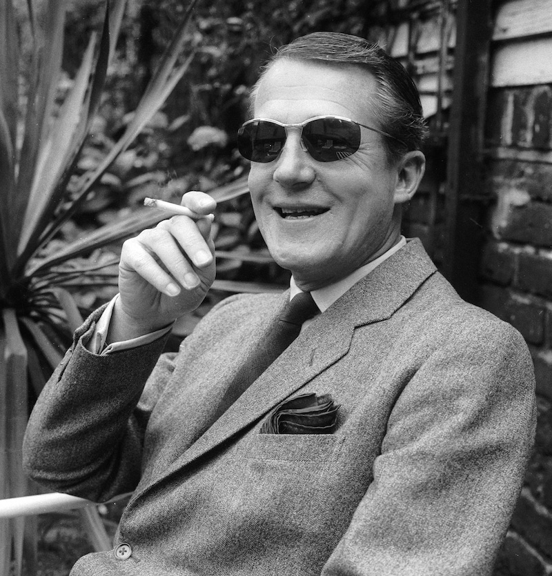 Hardy Amies relaxes outdoors. Photo by A. Jones/Evening Standard/Getty Images.