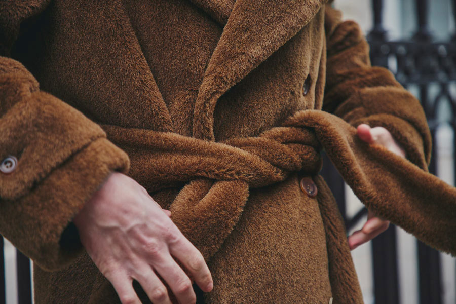 The coat has a double-breasted fastening and tie waist. Photograph by James Munro.