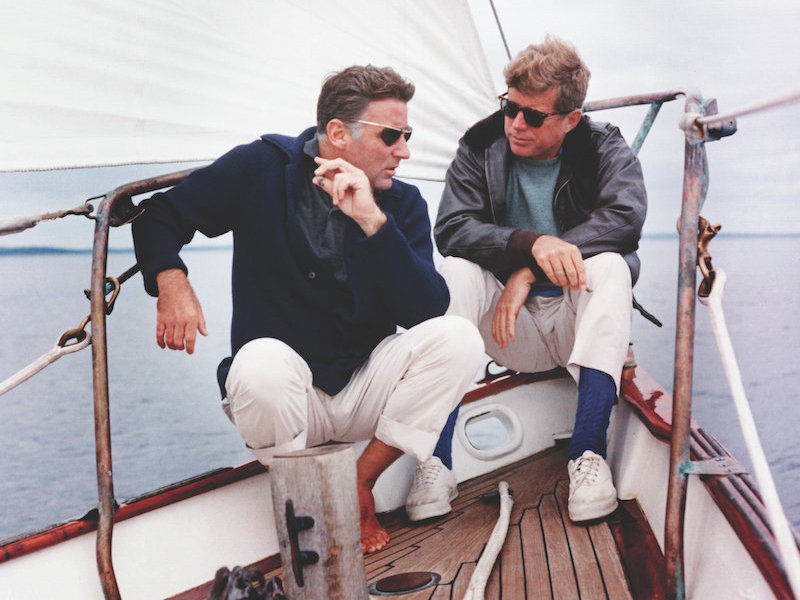 President Kennedy and his brother-in-law Peter Lawford aboard the United States Coast Guard yacht 'Manitou’, 1962. Image © CORBIS/Getty.