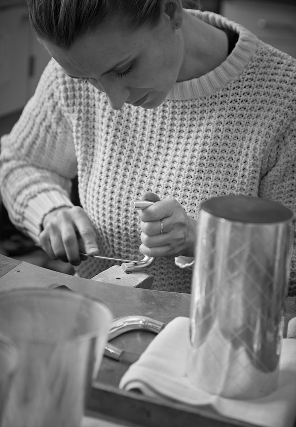 A piece from the Georg Jensen Bernadotte cocktail set being hand crafted.