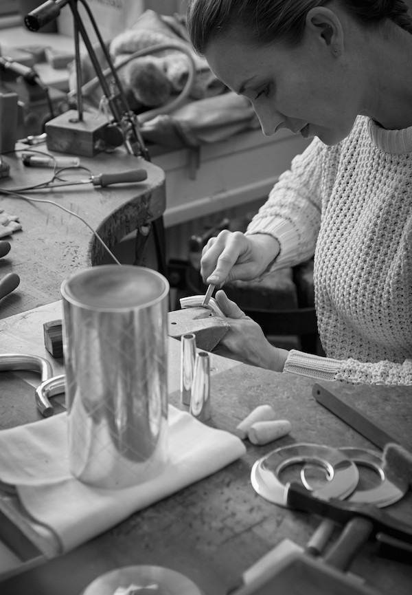 A piece from the Georg Jensen Bernadotte cocktail set being hand crafted.