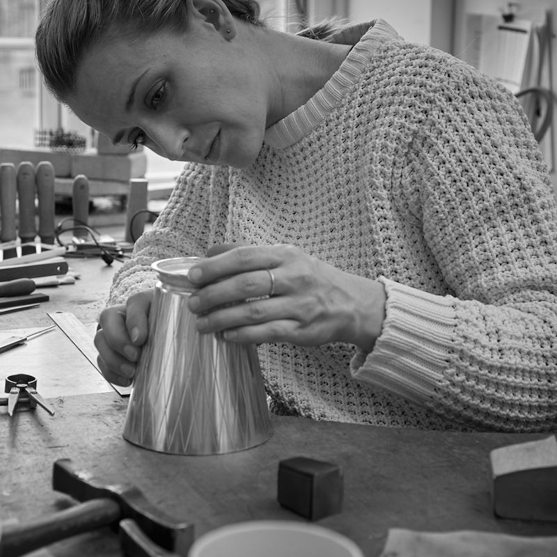 A piece from the Georg Jensen Bernadotte cocktail set being hand crafted.